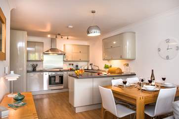 The kitchen is easily accessed from the dining-table.