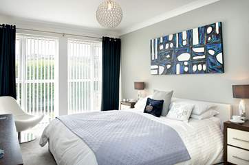 The master bedroom is bright and sunny and boasts an en suite shower room.