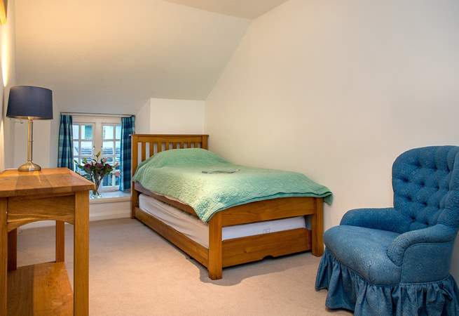 The single bedroom on the first floor is comfortably furnished.