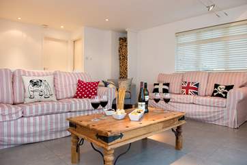 The sitting-room is very spacious and has plenty of room for everyone to relax.