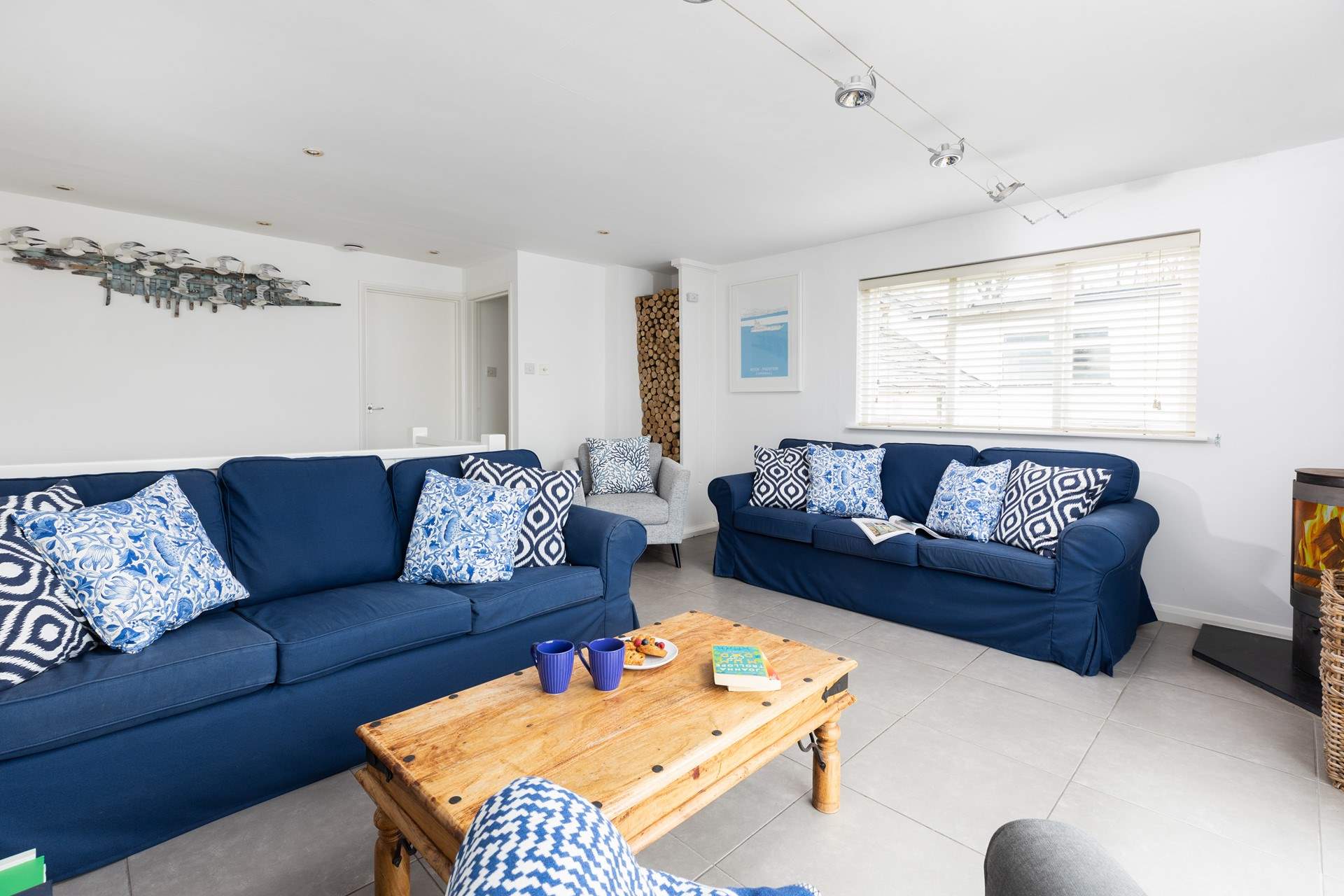 The sitting-room is very spacious and has plenty of room for everyone to relax.