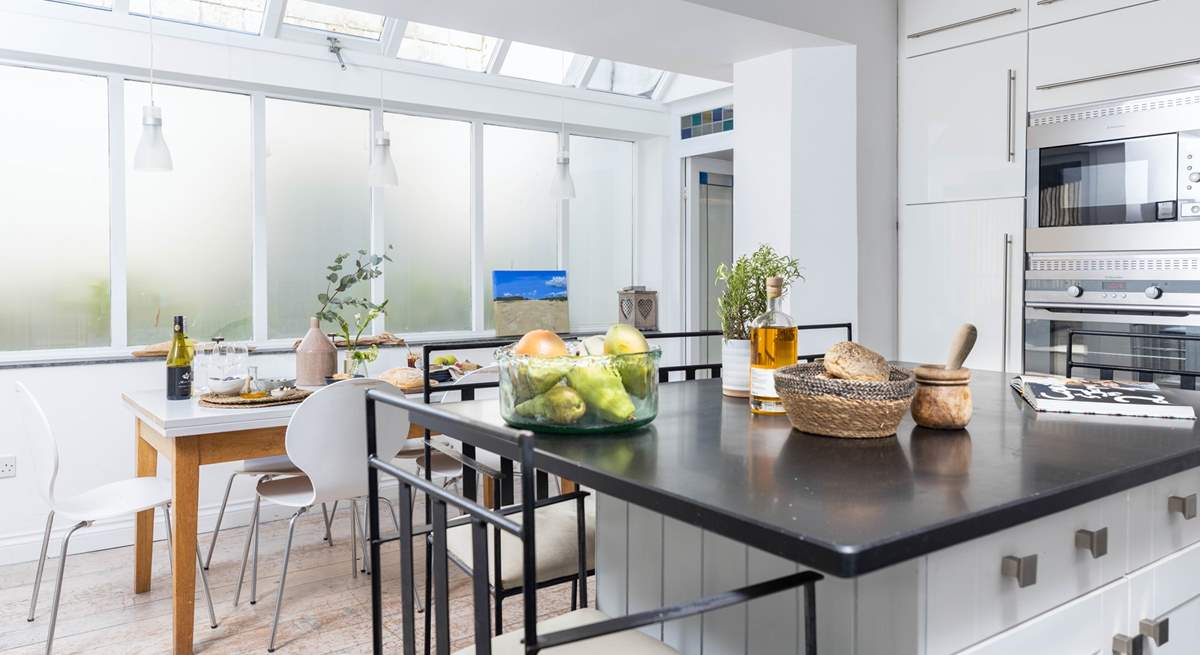 The kitchen/dining-room is wonderfully light and airy