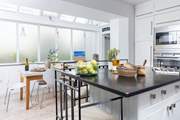 The kitchen/dining-room is wonderfully light and airy