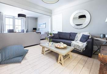 The sitting-room is divided into two seating areas, both equally as stylish