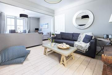 The sitting-room is divided into two seating areas, both equally as stylish