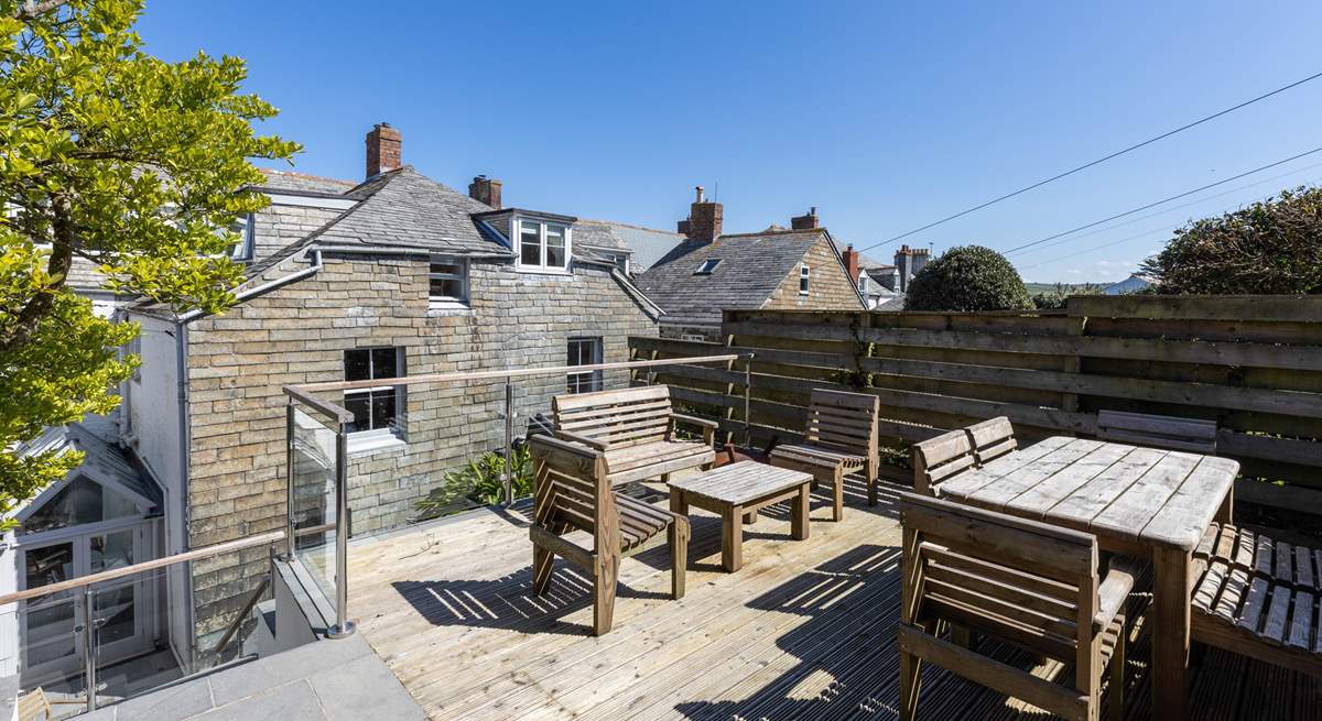 More seating on the higher terrace in the back garden