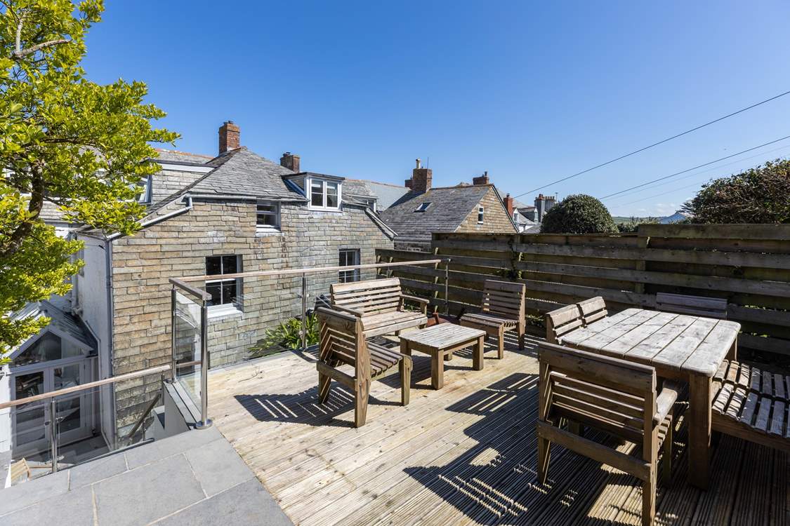 More seating on the higher terrace in the back garden