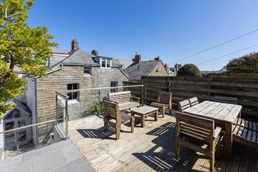 More seating on the higher terrace in the back garden