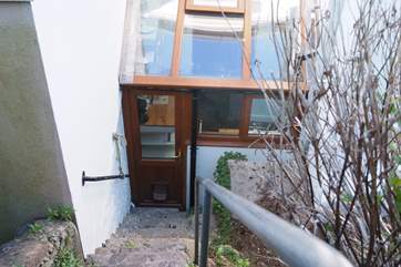 There are three terrace levels in the garden and this last flight of steps goes down to the back door (take care as they are steep).