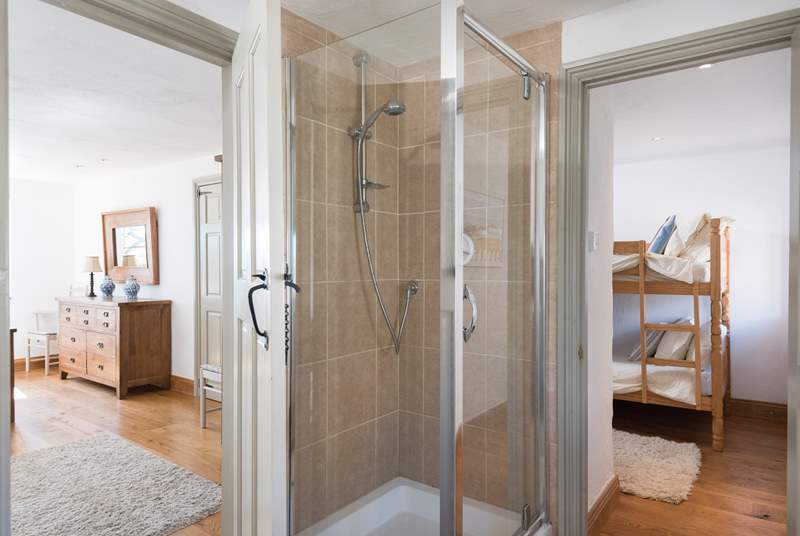 The large contemporary shower-room lies between the two bedrooms, with 'Jack and Jill' doors.