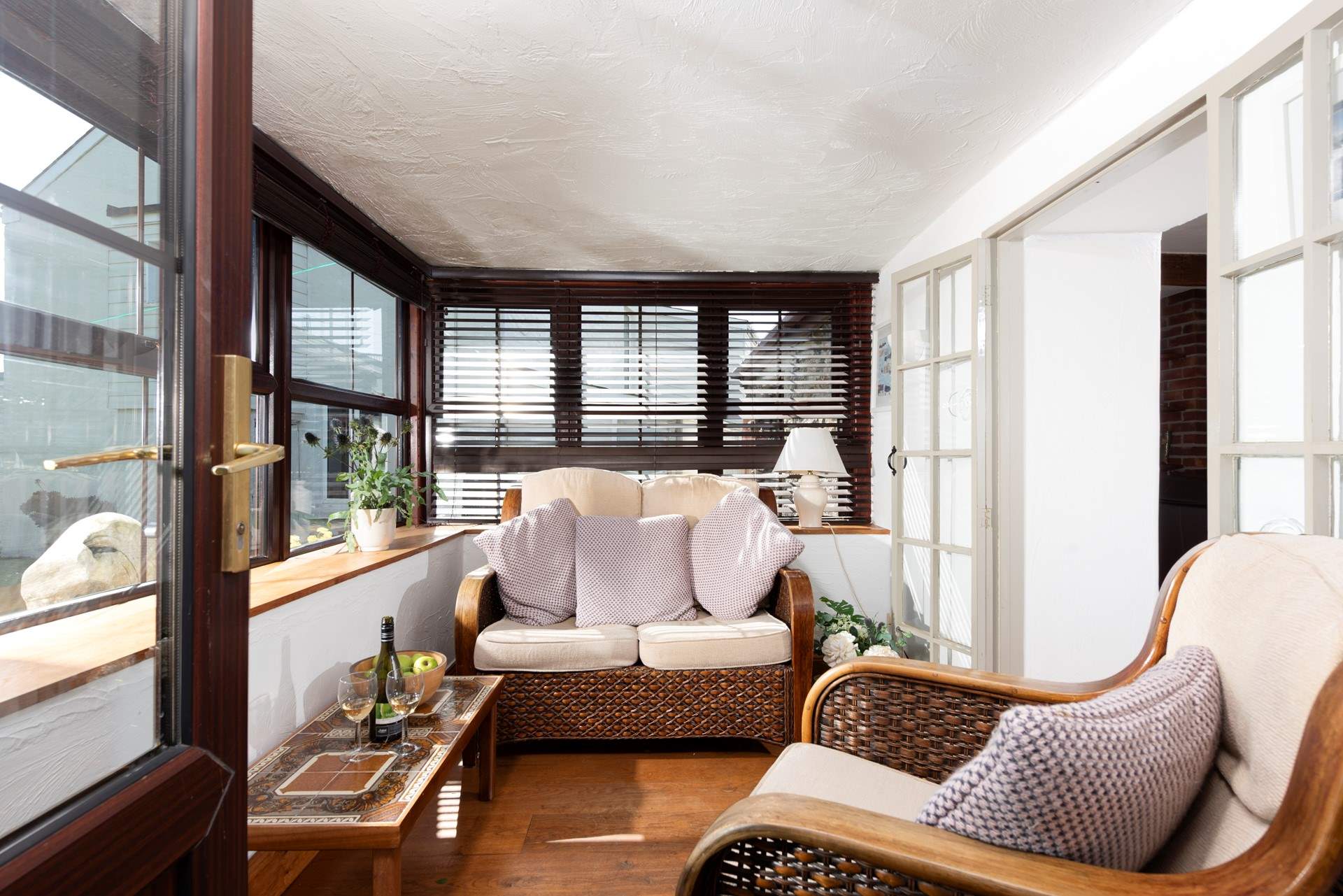The sun-room is the perfect spot to relax after exploring the nearby South West Coast Path.