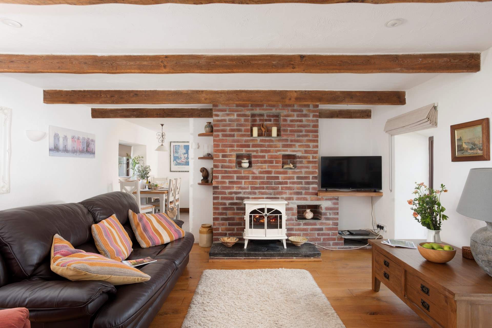 The sitting-room has access to the sun-room.