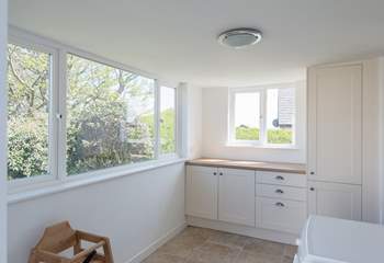The utility-room at the rear of the property has a door into the garden.