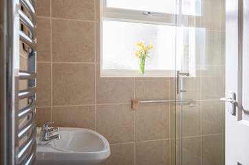 The fully tiled shower-room is next to the kitchen.