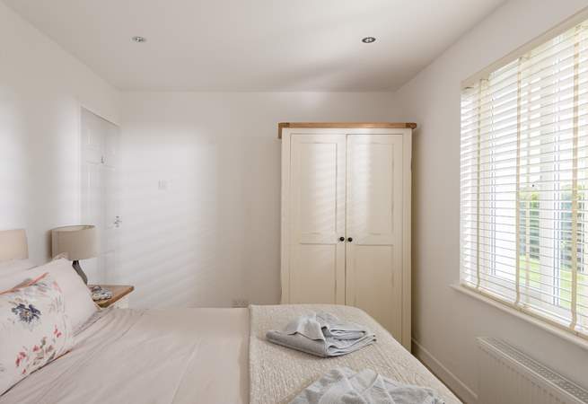 The bedrooms are dressed with lovely linens and all have plenty of storage.