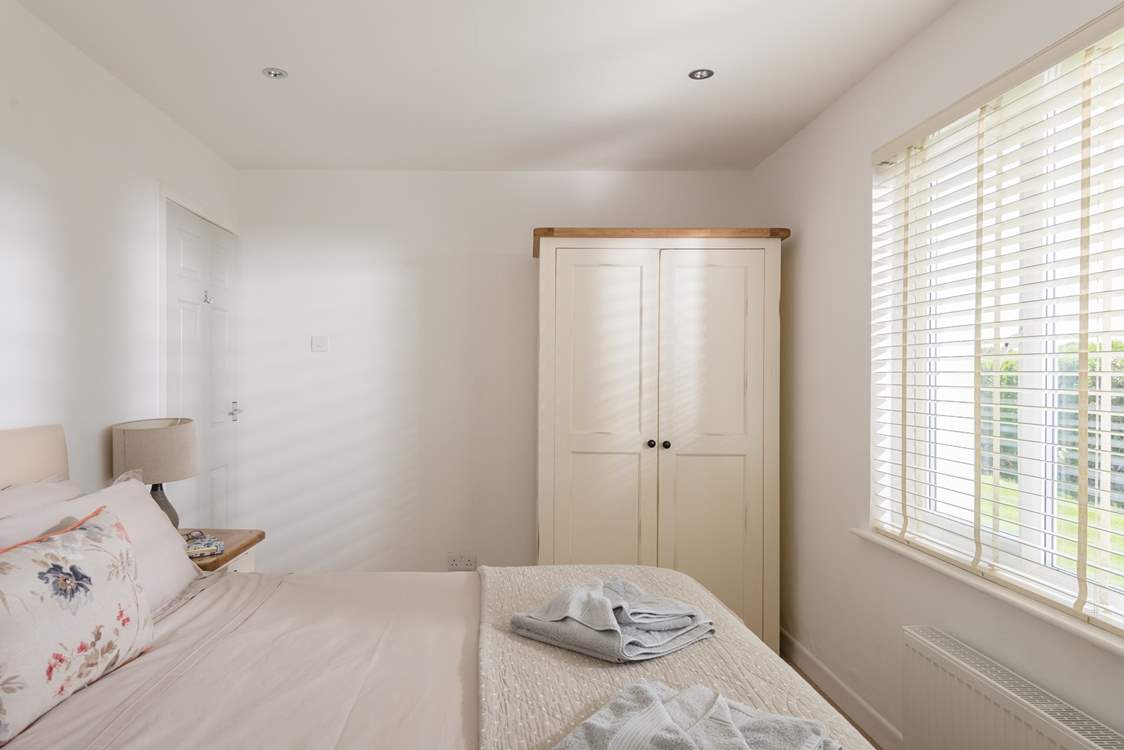 The bedrooms are dressed with lovely linens and all have plenty of storage.