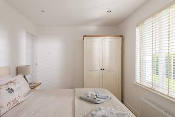 The bedrooms are dressed with lovely linens and all have plenty of storage.