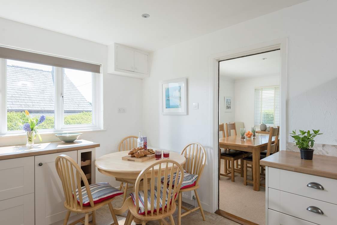 The kitchen leads through to the sitting/dining-room.