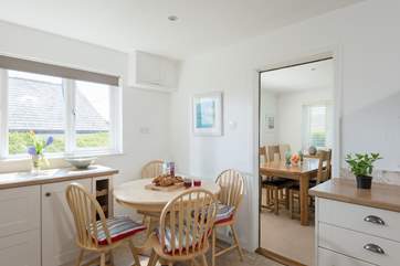 The kitchen leads through to the sitting/dining-room.