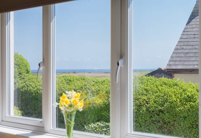 The sunny, contemporary kitchen has lovely sea views.