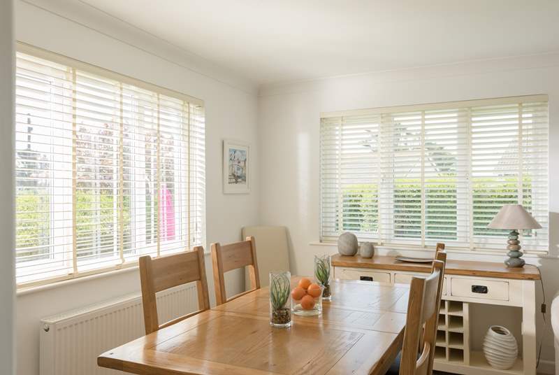 The dining-area has sea views between the neighbouring cottages.
