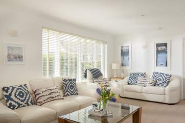 The spacious, light-filled sitting/dining-room.