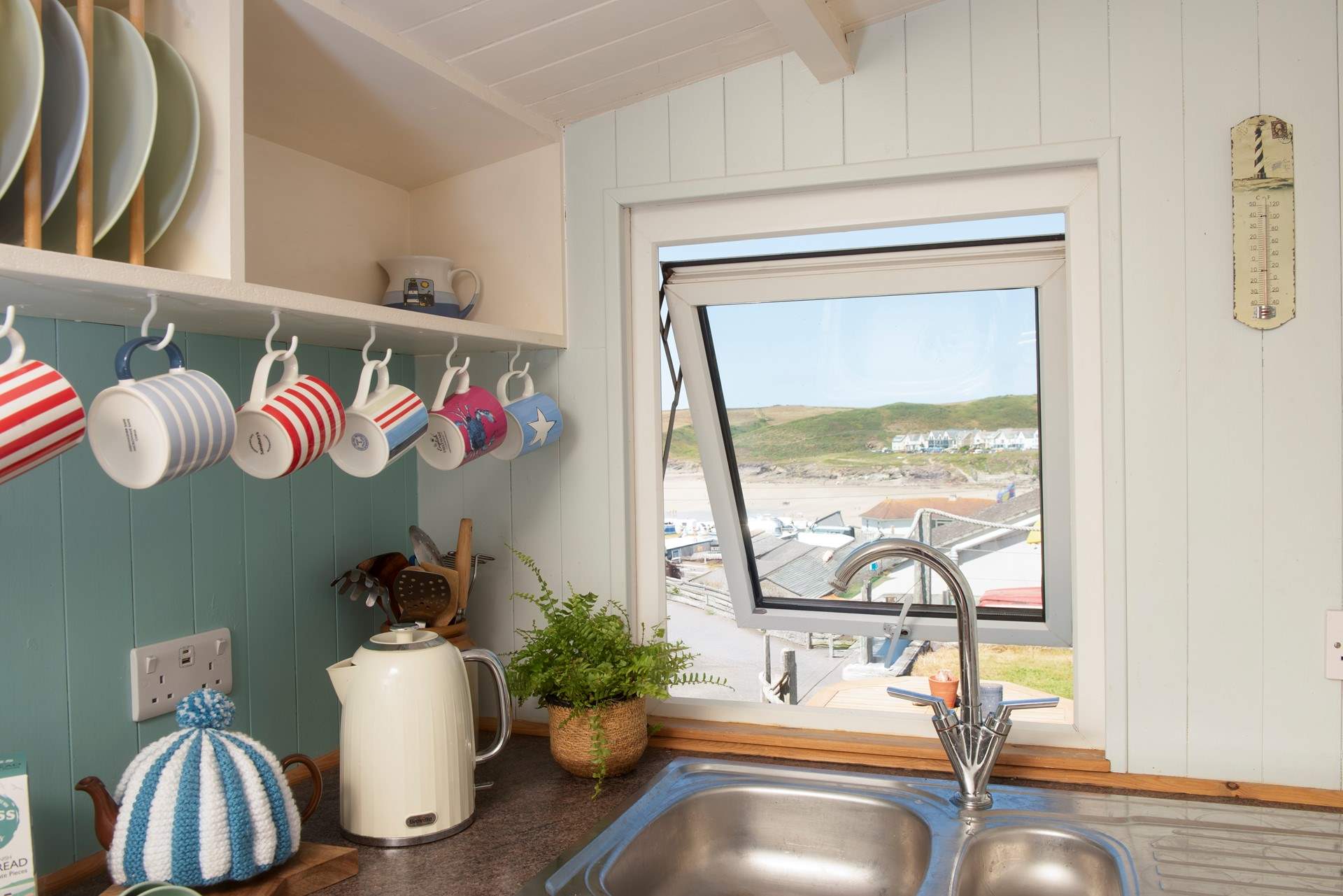 It's no chore being tied to the kitchen sink- with such a great view of the beach. 