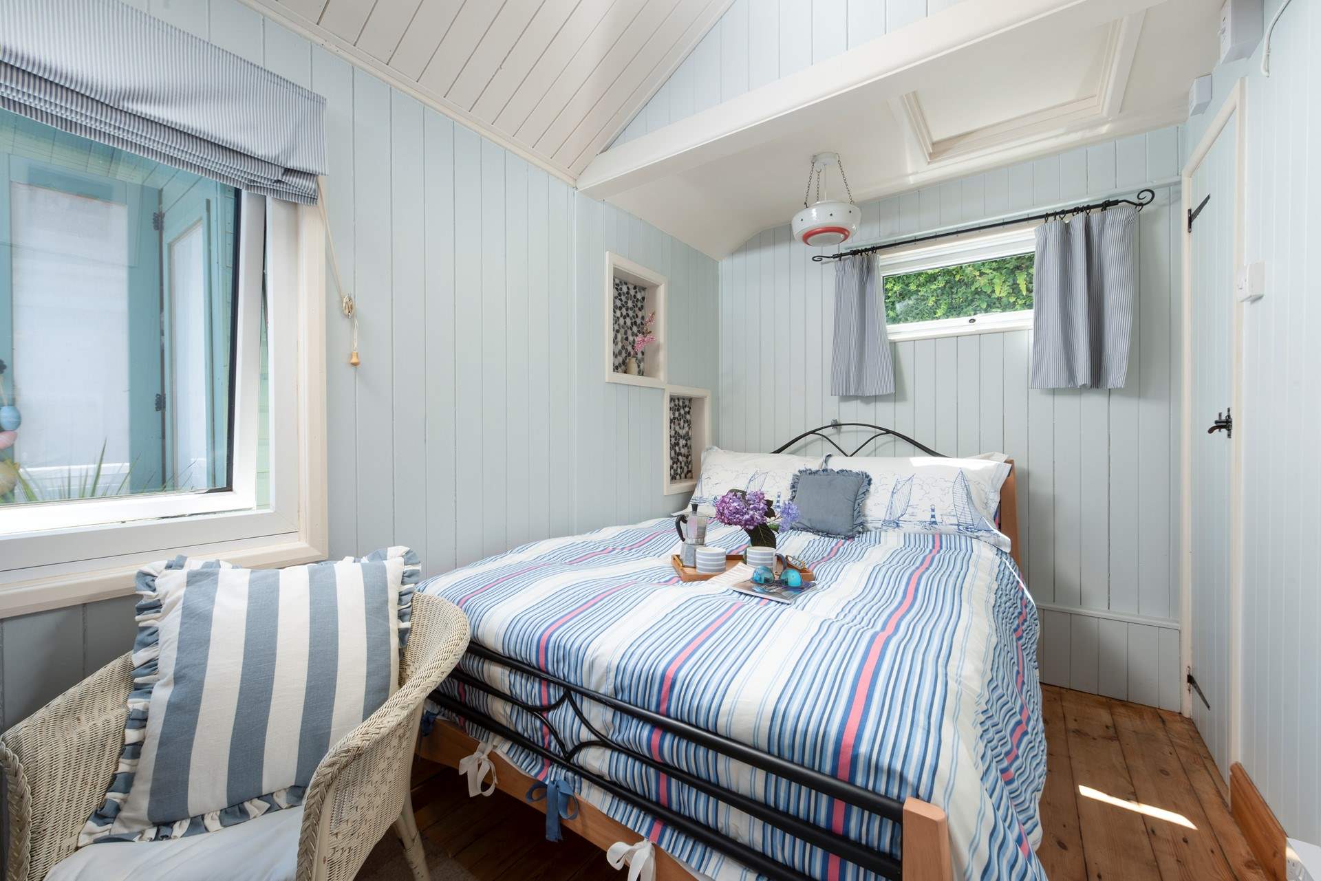 A comfy double bed awaits in bedroom 2.