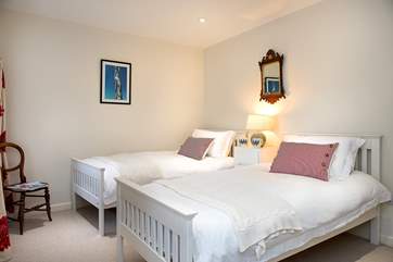 The twin bedroom overlooks the garden.