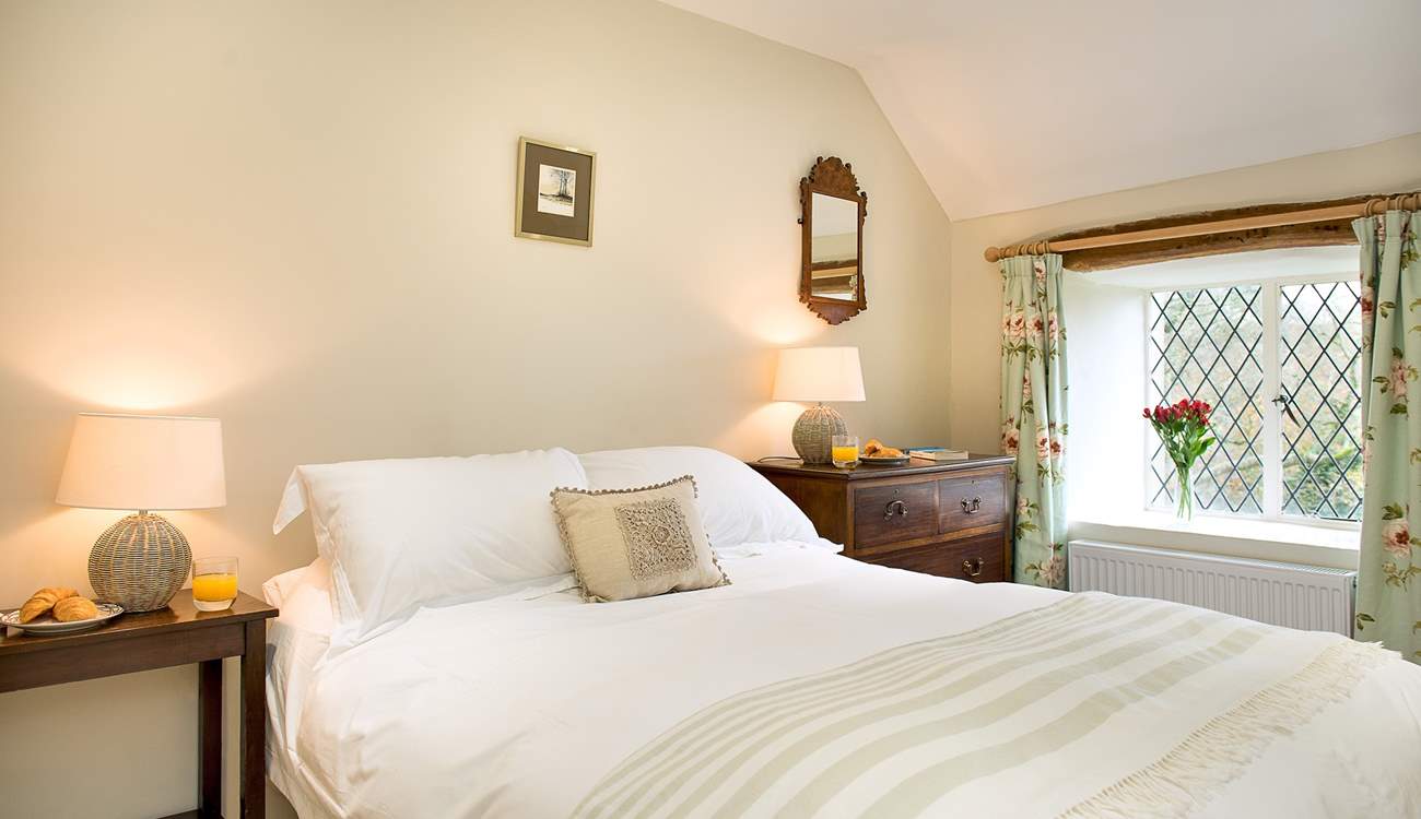 Each bedroom is individually styled. There are lovely linens and furniture in the double bedroom.