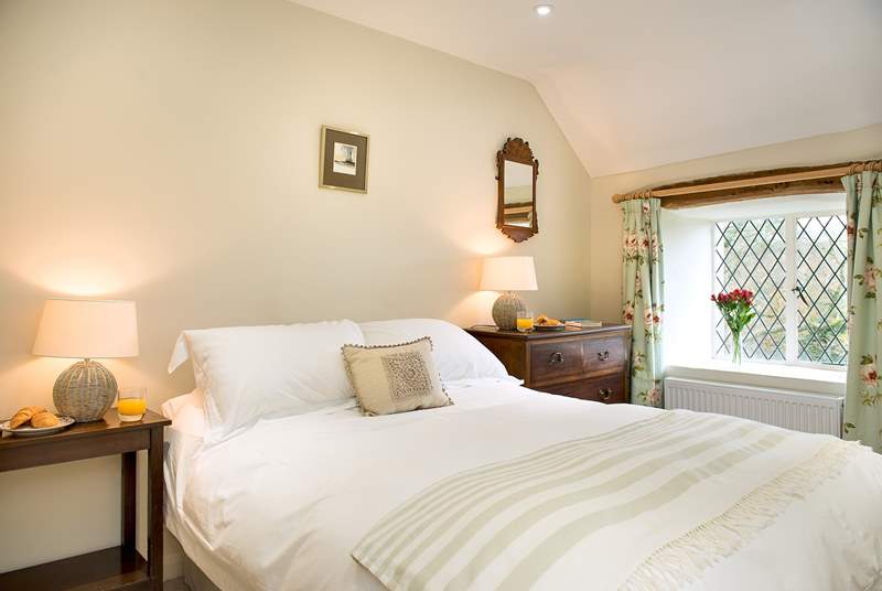 Each bedroom is individually styled. There are lovely linens and furniture in the double bedroom.