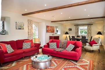 The sitting/dining-room is gorgeous and beautifully styled.