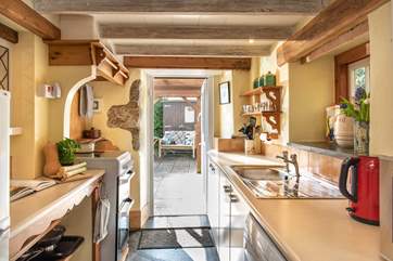 The kitchen opens to the sunny patio.