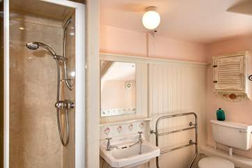 There is a shower and a bath in the family bathroom.