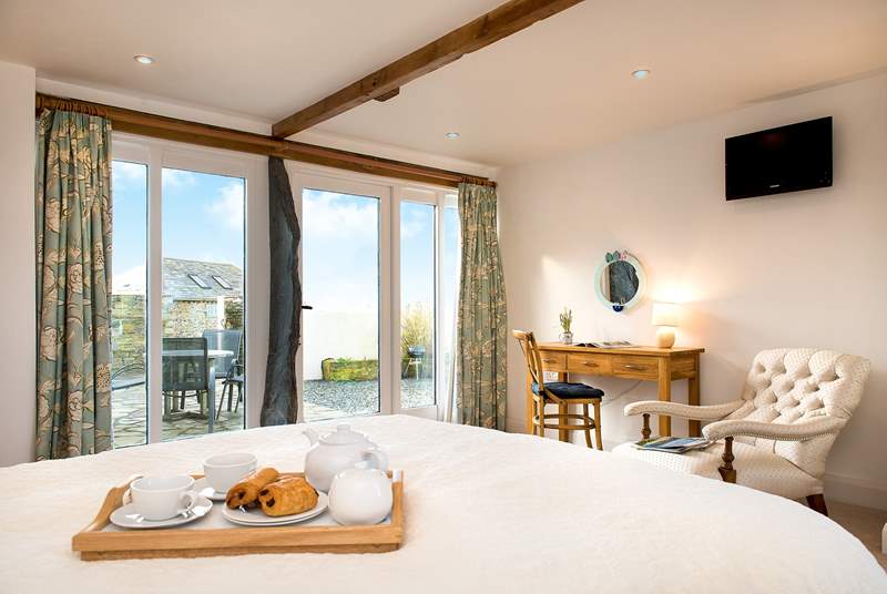 The dual-aspect bedroom boasts sea views.