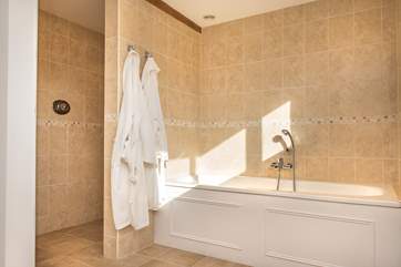 The bathroom is huge with a large walk-in shower. Bathrobes are also supplied.