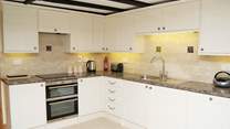 The modern bright fully equipped kitchen.
