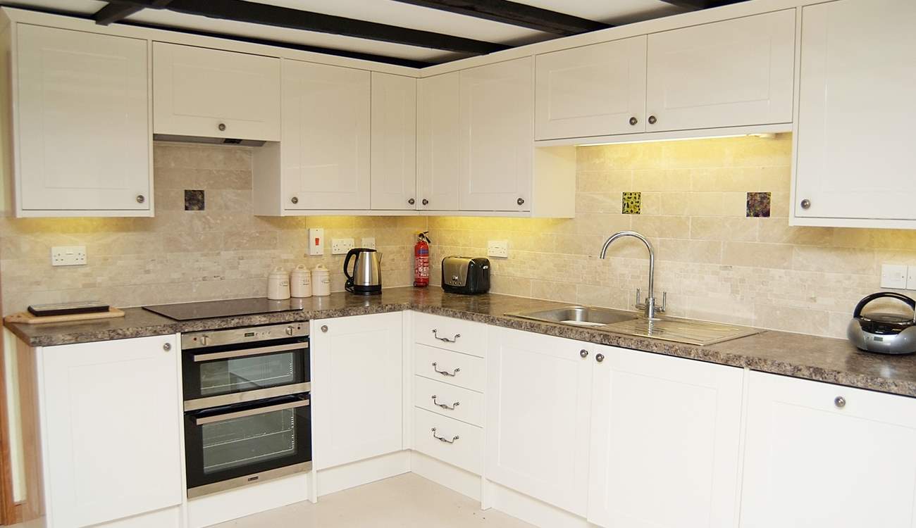 The modern bright fully equipped kitchen.