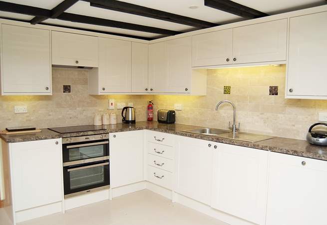 The modern bright fully equipped kitchen.