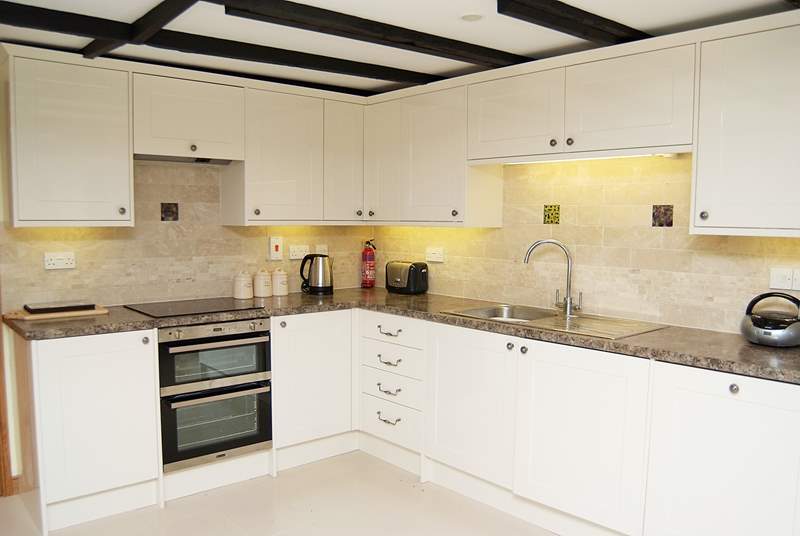 The modern bright fully equipped kitchen.