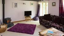 A warming wood-burner in the sitting-room.