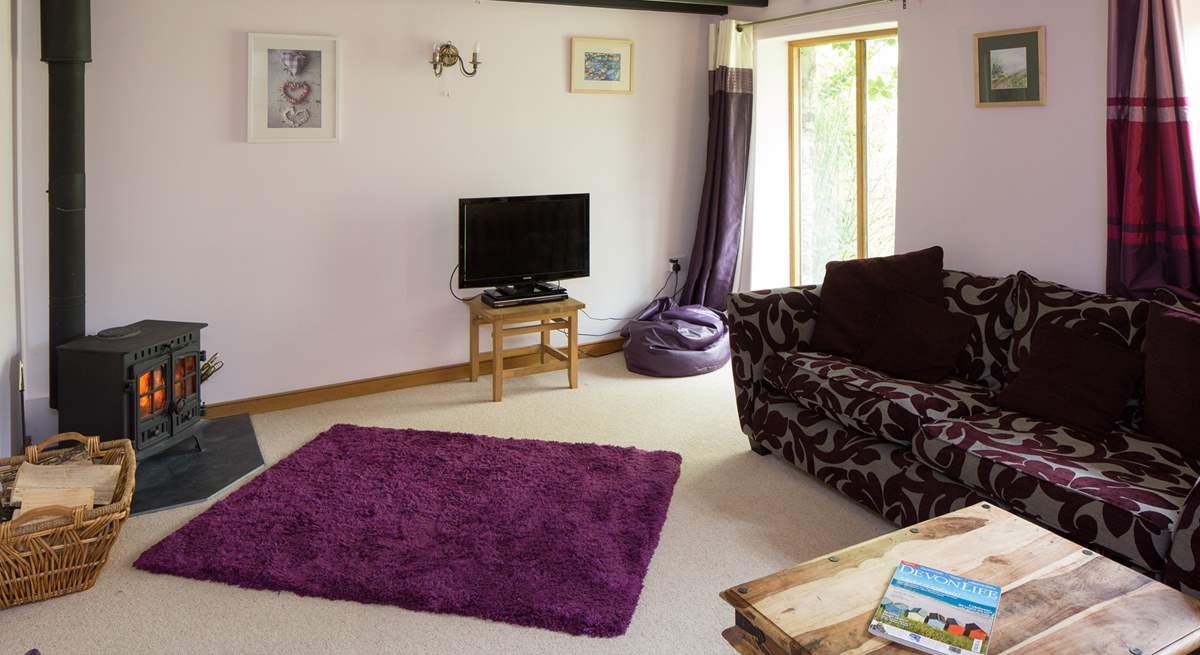 A warming wood-burner in the sitting-room.