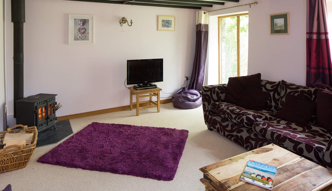 A warming wood-burner in the sitting-room.