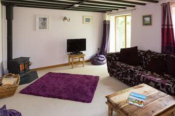 A warming wood-burner in the sitting-room.