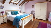 The gorgeous double bedroom is beautifully furnished and has an en suite shower-room.