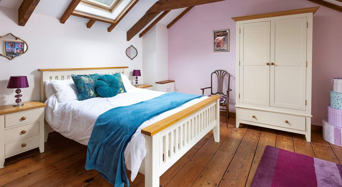 The gorgeous double bedroom is beautifully furnished and has an en suite shower room.