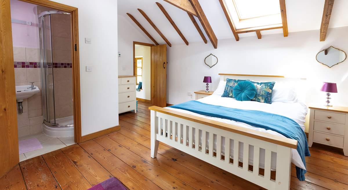 The delightful double bedroom is light and bright thanks to the Velux window.