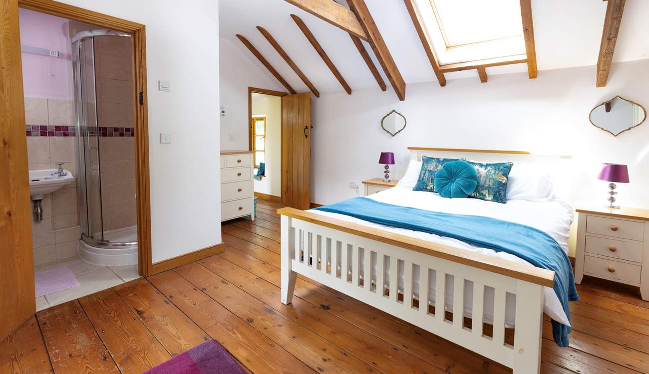 The delightful double bedroom is light and bright thanks to the Velux window.