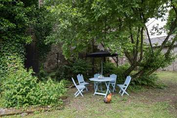 Table and chairs in the shared garden.