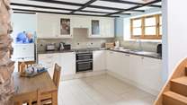 The well-equipped modern kitchen in a traditional barn.